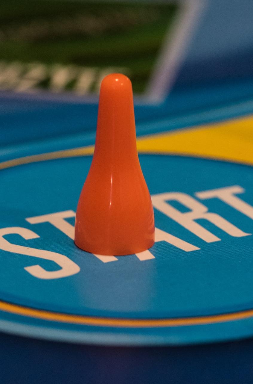 a close up of a game board with two cones